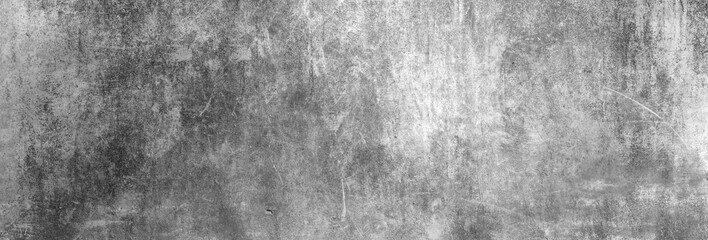 Textur einer dunkelgrauen und alten Betonwand als Hintergrund, auf die etwas Licht fällt - 199493715
