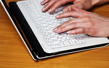 Girl prints on a laptop