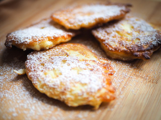 delicious pancakes with apples, pancakes with apples, sprinkled with white sugar.