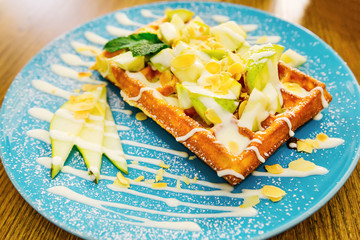 A close-up of a delicious dessert on a large blue plate