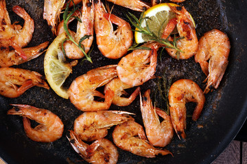 Grilled shrimp skewers. Seafood, shelfish. Shrimps Prawns skewers with herbs, garlic and lemon.