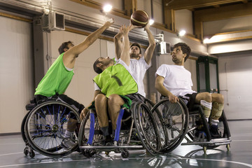 Fototapeta na wymiar disabled sport men in action while playing basketball