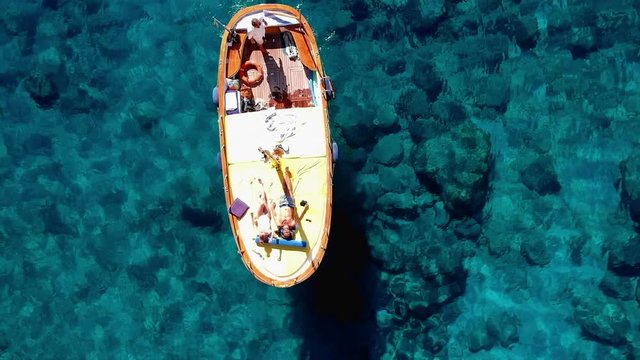 Aerial Zoom View of People in Boat