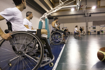 disabled sport men in action while playing basketball