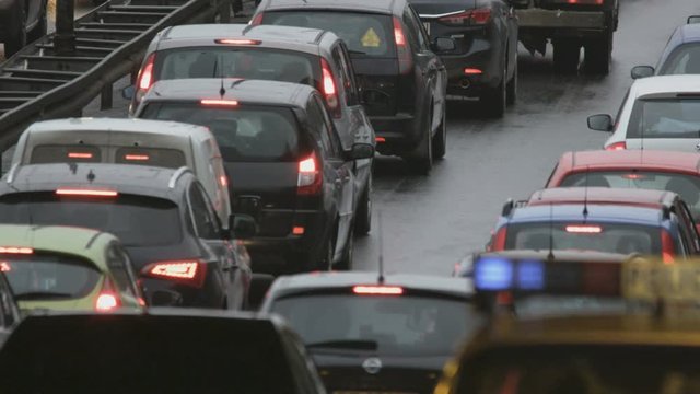 Vehicles Stuck in a Traffic Jam. Police Car