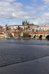 Early Spring Prague gothic Castle with the Lesser Town above River Vltava in the sunny Day, Czech...