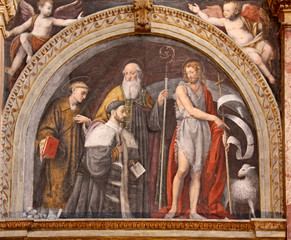 Fototapeta premium Alessandro Bentivoglio accompagnato dai Santi Stefano, Bernardo e Giovanni Battista; affresco di Bernardino Luini. Chiesa di San Maurizio, Milano