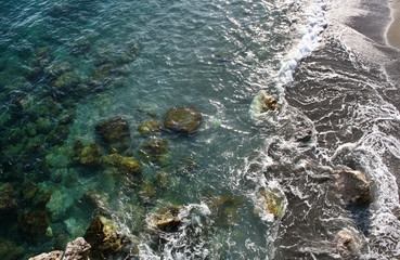 Fototapeta na wymiar Background texture of the clear blue water of the mediterranean sea