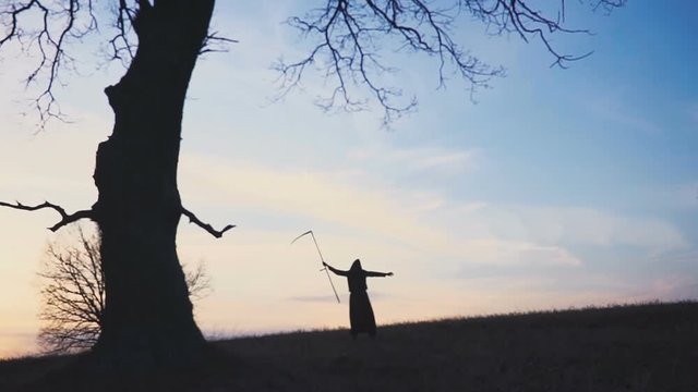 Grim Reaper sunset silhouette. concept of death.