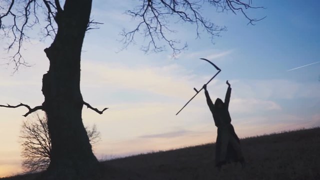 Grim Reaper sunset silhouette. concept of death.
