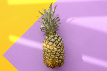 Fresh ripe pineapple on color background, top view
