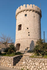 Fototapeta na wymiar Medieval tower of the cit of Cres on a sunny morning