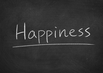 Obraz premium happiness concept word on a blackboard background