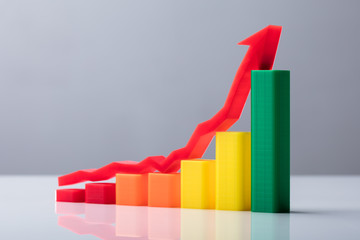 Multi Colored Business Graph With Arrow Sign