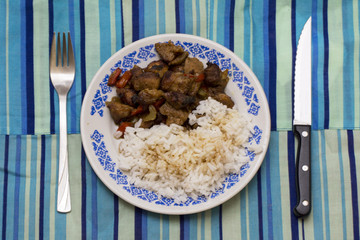  Variation of “Kao Krapaomoo” . Rice with tired munched pork and basil, pepper bell and apio. Thai food.