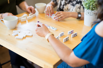 Obraz na płótnie Canvas Female friends playing dominoes