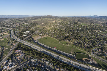 Fototapeta na wymiar Aerial view of homes, parks and Route 23 Freeway near Los Angeles in suburban Thousand Oaks, California. 
