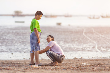 Mother and kid on the beach , happy mothers day vintage retro style