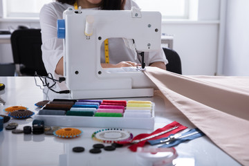 Fashion Designer Stitching Cloth On Sewing Machine