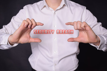 A businessman shows an inscription:SECURITY BREACH