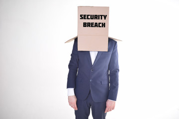 The businessman is holding a box with the inscription:SECURITY BREACH
