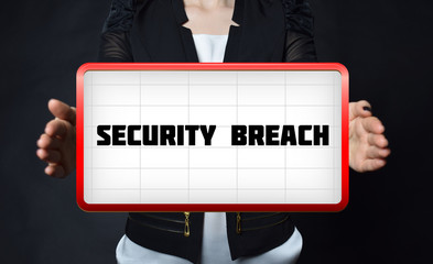 A businessman shows an inscription:SECURITY BREACH