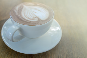 hot chocolate in cup on wood table
