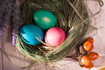Fototapeta na wymiar Colorful easter eggs in basket a