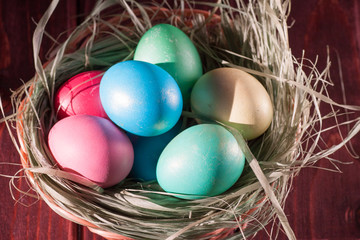 Colorful easter eggs in basket a