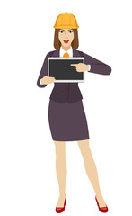 Businesswoman in construction helmet pointing at a digital tablet PC