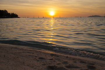 Beautiful sunset above the sea beach.