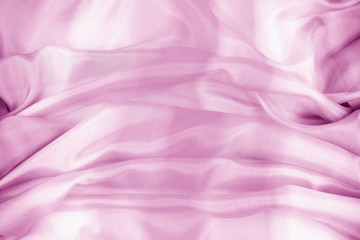 The texture of the satin fabric of lilac color for the background 