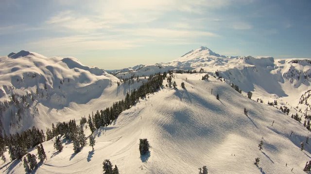 People Skiing at Mount Baker Ski Resort Mountain Landscape Travel Skiing Destination Washington State Cascade Mountains Aerial Flyover