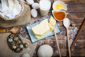 Natural organic ingredients to make cookies as dough, flour, eggs, butter, milk