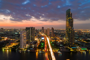 Fototapeta na wymiar Panorama sunset colourful sky view of Bangkok cityscape with building river side view