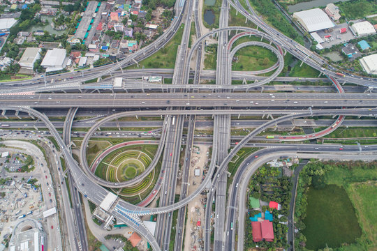 Aerial day view of traffic junction cross road