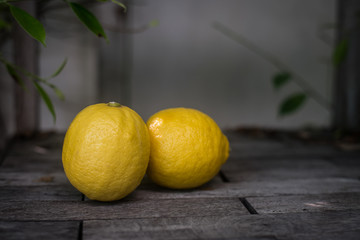 Lemons on a wooden background. Top view. Free space for text.
