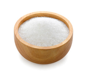 monosodium glutamate in wood bowl on white background