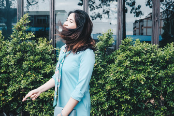 Asian beautiful young women relaxing on green plant background