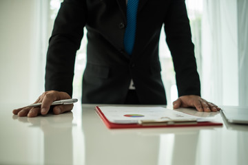 Young businessman working with laptop at office