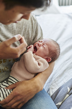 Father with crying baby