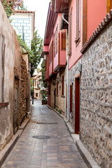 Travel concept. Cozy narrow streets of old city in Antalya. 