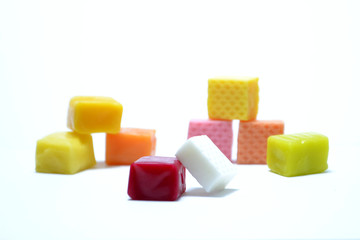  Colored chewing sweets on white background