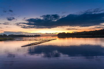 Naklejka na ściany i meble Wonderful blue sunset at the lake in summer, Poland