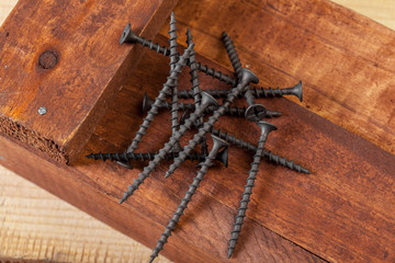 screws on a wooden table