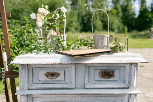 Wooden Vintage Dresser With Flower Decoration In Garden Outdoor