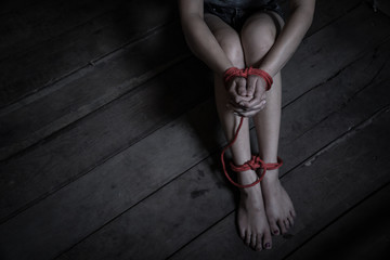 Victims of abducted women get wrists and feet in red..Hostage concept or female kidnapped from...