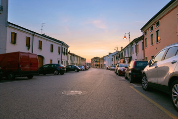 Fototapeta premium Montagnana, Italy - August 25, 2017: Alberti Street in the evening at sunset.