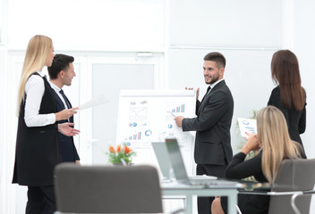 businessman makes a presentation to his business team