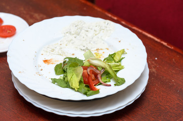 Dirty dishes on the table in the room after a vegetarian meal.